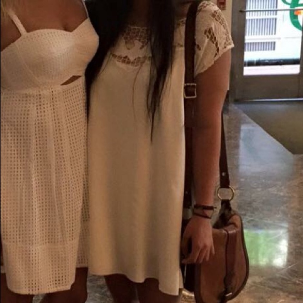 cream with lace net detailing dress.